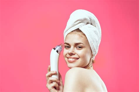 Premium Photo Woman With Bare Shoulders With A Towel On Her Head