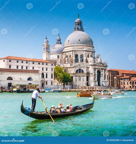 Traditional Gondola On Canal Grande With Basilica Di Santa Maria Della