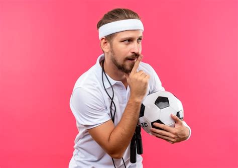 Free Photo Impressed Young Handsome Sporty Man Wearing Headband And