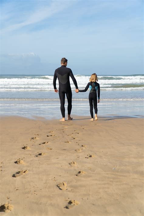 Man Walking Barefoot along Beach · Free Stock Photo