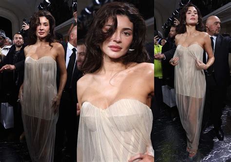 Kylie Jenner Stuns In A Sheer Gown And Undone Locks At 2024 Paris Fashion Week