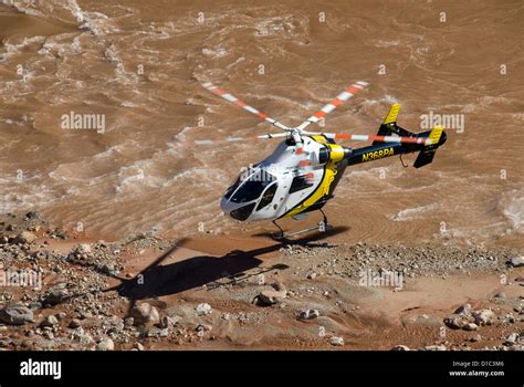 National Park Service Rescue Helicopter Landing Next To The Colorado River In The Grand Canyon