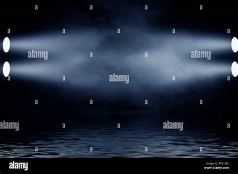 Projector spotlight with reflection in water. Isolated on black ...