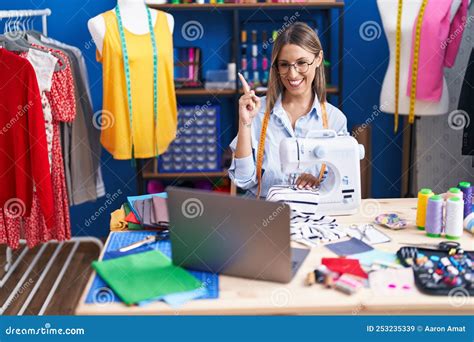 Young Dressmaker Woman Using Sewing Machine Smiling Happy Pointing With