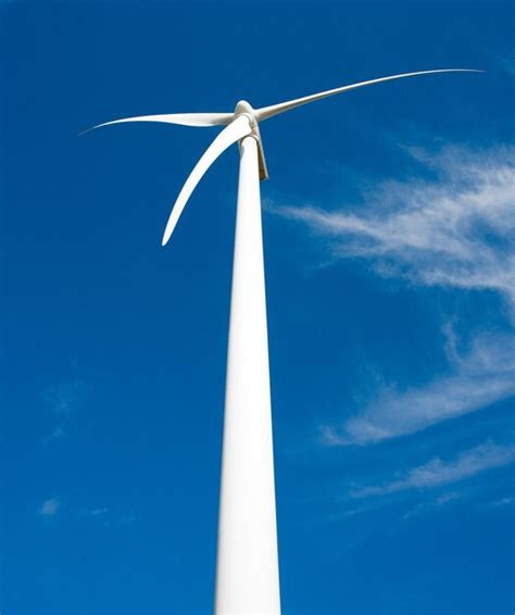 Premium Photo Low Angle View Of Wind Turbine Against Blue Sky