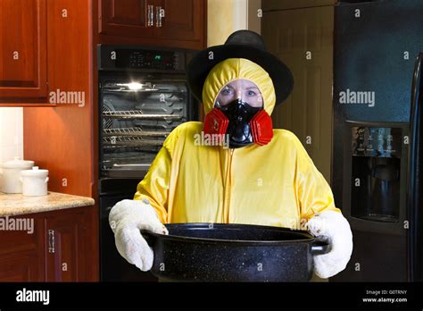 Woman In Yellow Hazmat Suit And Respirator Wearing Pilgrim Hat Standing