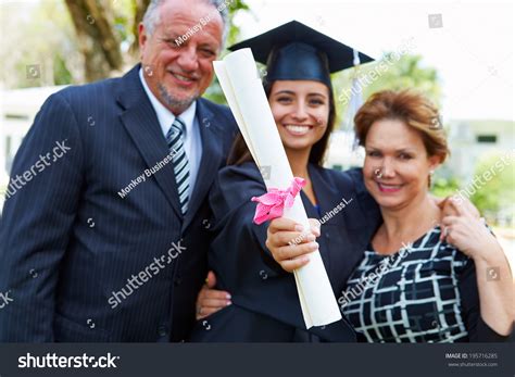 Hispanic Student Parents Celebrate Graduation Stock Photo 195716285 ...