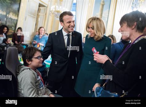 French President Emmanuel Macron and his wife Brigitte attend the ...