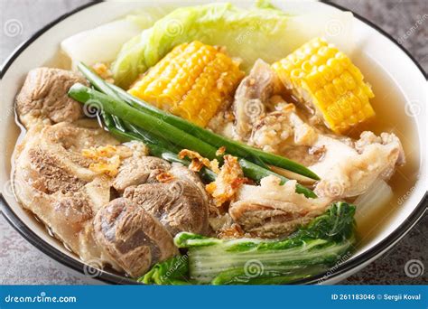 Bulalo Is A Filipino Boiled Soup Made With Bone-in Beef Shanks, Corn And Cabbage Leaves Closeup ...