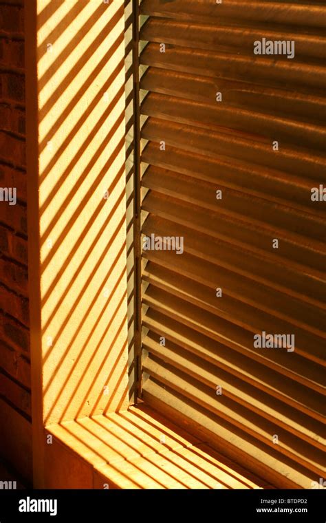 Wooden Window Louvers With The Sun Shining Through Stock Photo Alamy