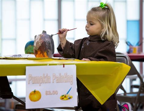 Vibrant Fall Festivities Rosalyn Paye Painting A Pumpkin At St John