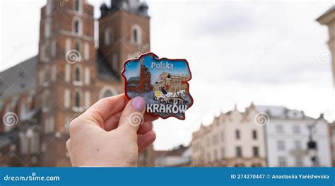 Female Hand Holding Souvenir Magnet Next To St Mary X27 S Basilica On