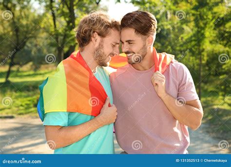 Happy Gay Couple With Rainbow Flag Stock Image Image Of People