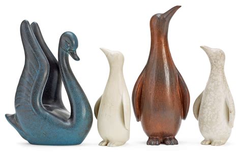 Four Gunnar Nylund Stoneware Figures A Swan And Three Penguins