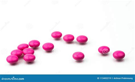 Pile of Pink Round Sugar Coated Tablets Pills Isolated on White ...