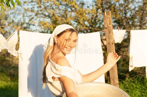 Young Woman Hanging Laundry Outdoors Beautiful Girl Working In