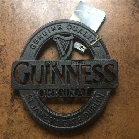 GUINNESS CAST IRON Hot Plate Trivet Official Product Four Metal Feet Collectable