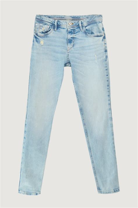 Jean Azul Claro Skinny Tiro Bajo Con Rotos Sutiles En Frente