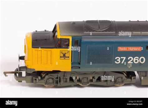 Close Up Of A Hornby Electric Class 37 Diesel Model Train In Blue And Yellow Livery Shot Against