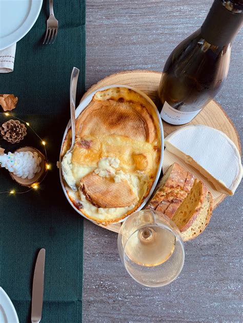 A Table Topped With Food And Wine On Top Of It