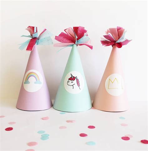 Three Party Hats With Different Designs On Them