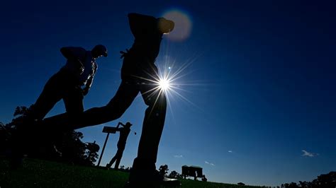 Yuxin Lin Of China Is Silhouetted As He Drives No 1 During Round 2 Of