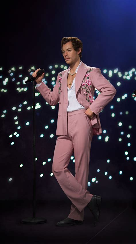 Madame Tussauds Debuts Harry Styles Wax Figures in Glam-rock Looks