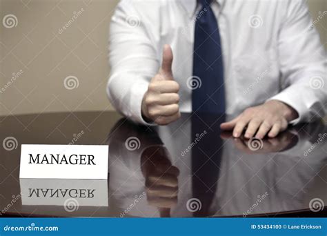 Manager At Desk Holding Thumbs Up Sign Stock Photo Image Of Executive