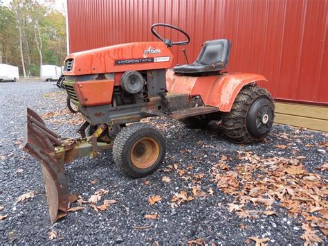 Ariens S-14H hydrostatic garden tractor with four foot push blade with power lift, tire chains ...