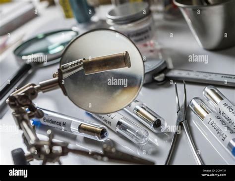 Scientific Police Examining A Bullet Cap In Ballistic Laboratory