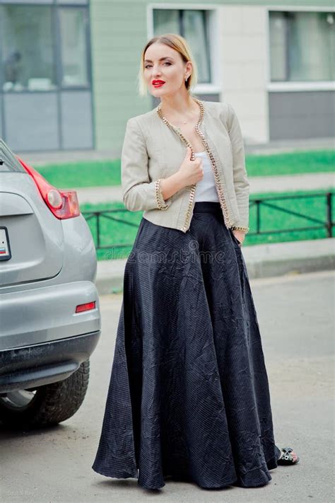 Stylish Fashion Portrait Of Blonde Woman Posing In The City Stock