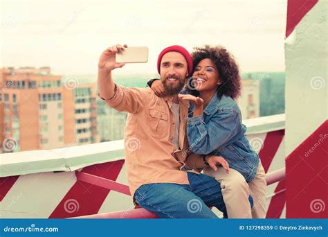 Beautiful Woman Sending Air Kisses While Taking Selfies With Boyfriend