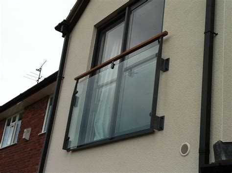 Fabricated Glass Balcony System With Iroko Timber Handrail And