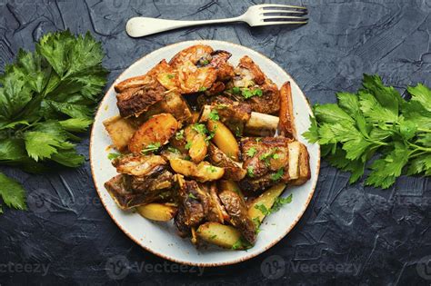 Beef stew with potatoes. 13350890 Stock Photo at Vecteezy