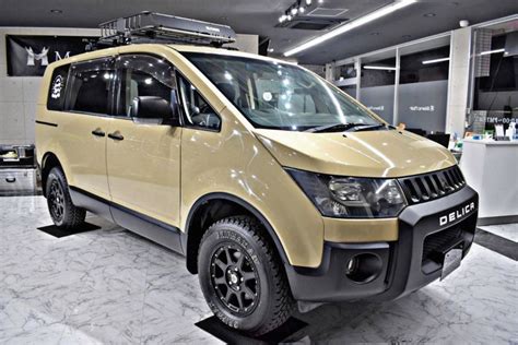 A Yellow Van Is Parked In A Showroom