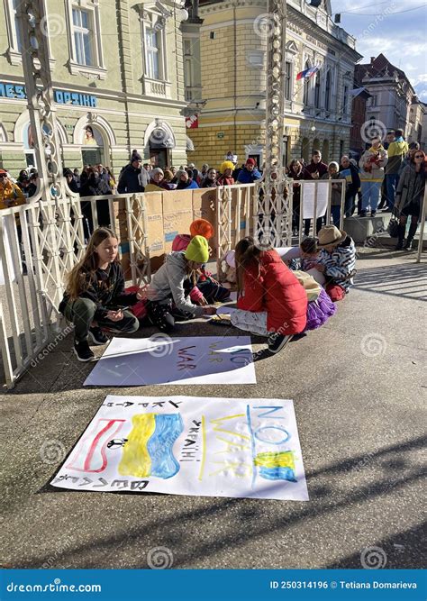 War in Ukraine. Children Draw Posters in Support of Ukraine. People