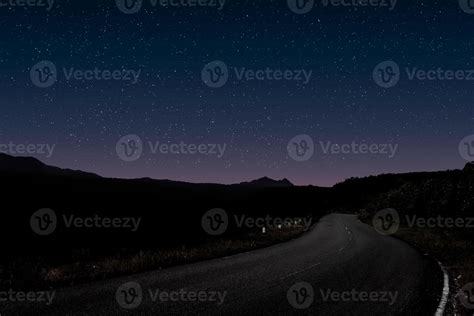 Mountain forest road night landscape 12736095 Stock Photo at Vecteezy