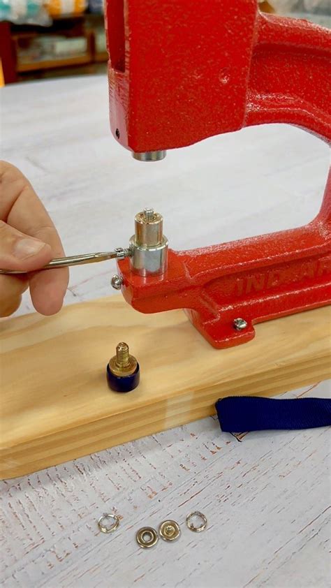 A Person Using A Small Tool On A Piece Of Wood That Is Being Worked On