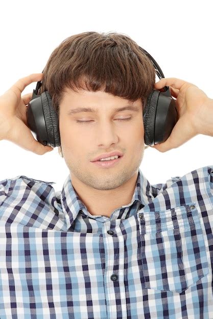 Premium Photo Close Up Of Man With Eyes Closed Listening To Music