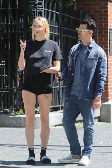 Sophie Turner Out In Nyc In Denim Shorts Adidas Slides With Socks Footwear News