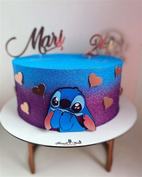 A Blue And Purple Cake With Hearts On It