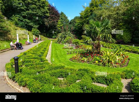 People seated in the Italian Gardens, Valley Gardens, Saltburn by the ...