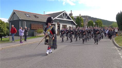 Ellon District Pipe Band Marching Through Village To The 2023 Braemar