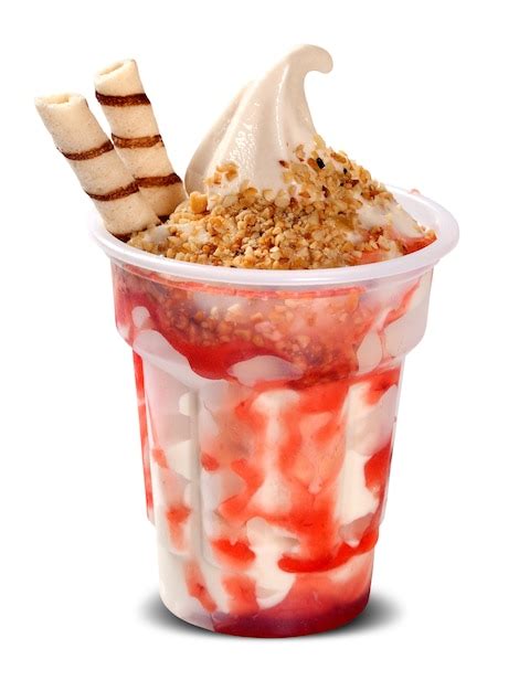 Premium Photo | Strawberry sundae ice cream with strawberry syrup in ...