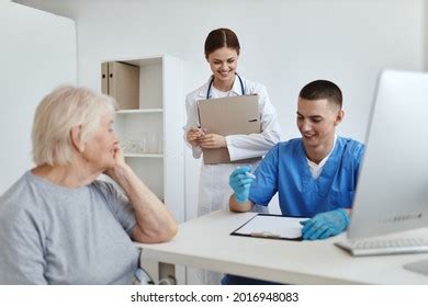 Doctor Nurse Examines Patient Hospital Service Stock Photo 2016948068 ...