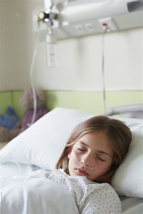 "Patient Child In A Hospital Bed Sleeping" by Stocksy Contributor ...