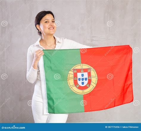 Pretty Smiling Female Football Fan Holding Portugal Flag Stock Photo