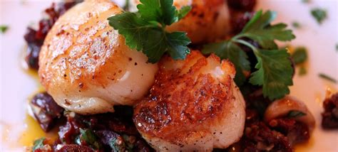 Seared Sea Scallops With Garlic Sun Dried Tomatoes And Olive Compote