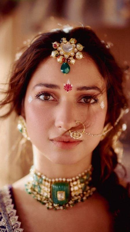 Tamannaah Bhatia Exudes 'Radharani' Elegance in Rich Violet Lehenga ...