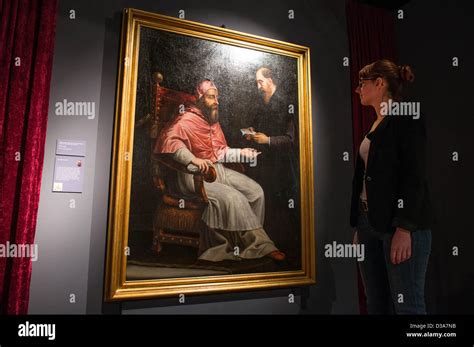 A Woman Looks At A Painting Of Pope Clemens Vii At The